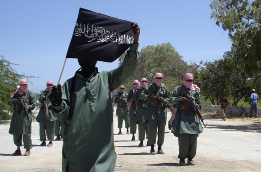 Militants of al Shabaab train with weapons on a street in the outskirts of Mogadishu