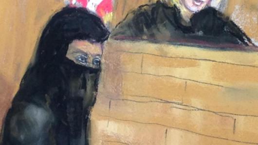 Keonna Thomas appearing in court after arrest on terrorism charges. Why she is allowed to appear in court covered that way is anyone's guess.